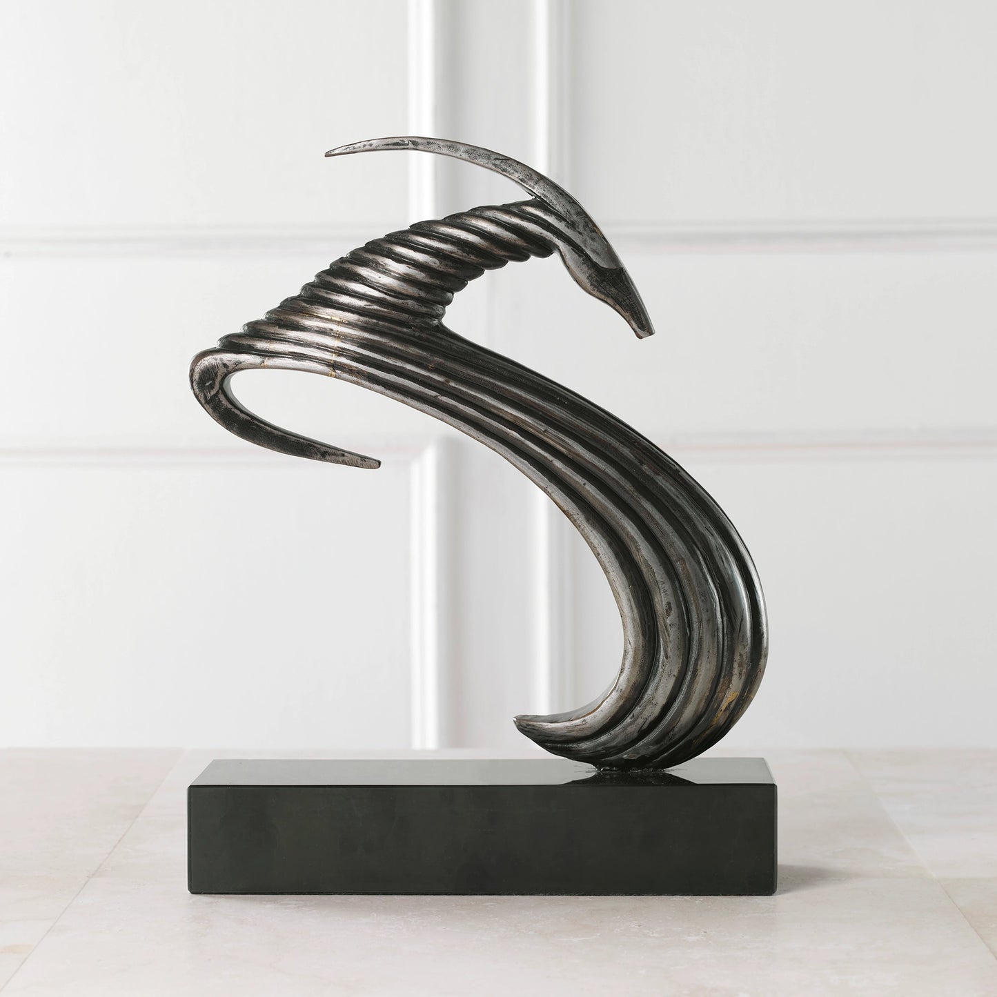 005 SI-1981245 | Lifestyle | Take the Lead Sculpture by Uttermost in aged silver. Made from iron, marble in a modern style.