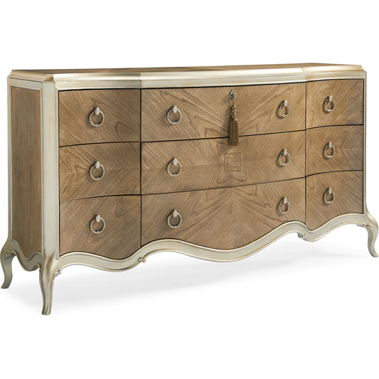 Triple Dresser by Caracole in champagne mist and cendre, champagne mist. Made from asian hardwood, bleached flat cut walnut in a transitional style.