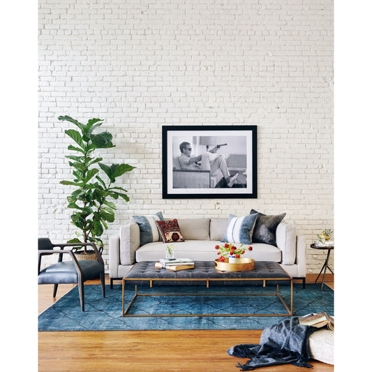 Oxford Coffee Table by Four Hands in rialto ebony and antique brass. Made from top grain leather, iron, 100% polyester in a modern style.