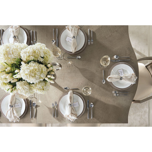 On a Silver Platter Dining Table by Caracole in maple, silver and moonlit sand, soft silver leaf. Made from pine, birch, silver curly maple in a transitional style.