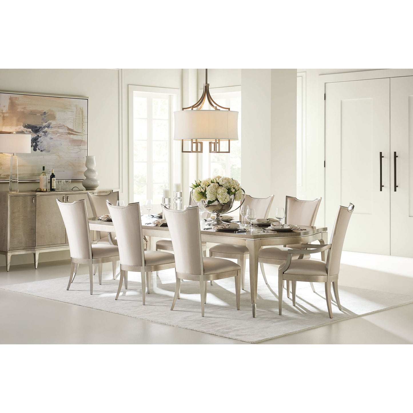 007 SR-768964 | Lifestyle | On a Silver Platter Dining Table by Caracole in maple, silver and moonlit sand, soft silver leaf. Made from pine, birch, silver curly maple in a transitional style.