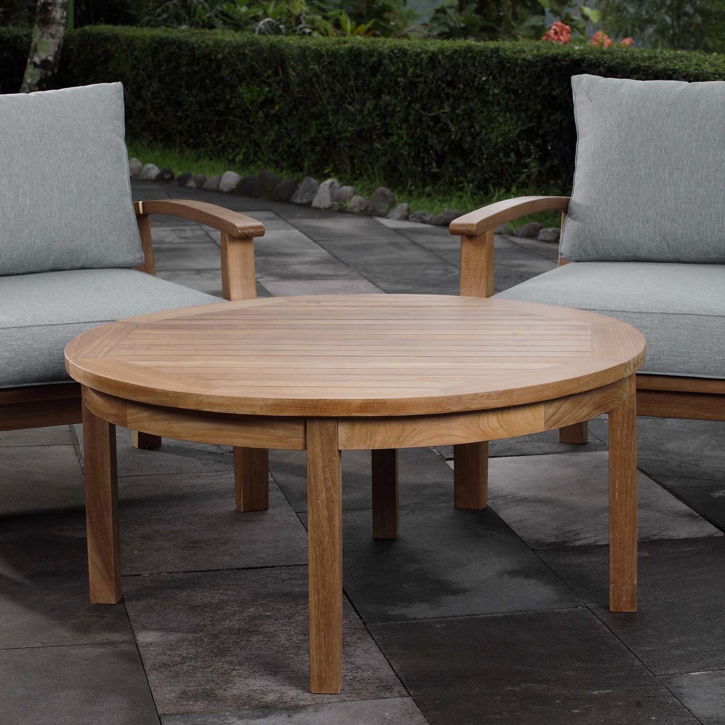 004 S-293774 | Lifestyle | Andover Teak Round Coffee Table by Evans & Londeen in natural. Made from teak wood, cushion density is 24kg, m3 in a modern style.