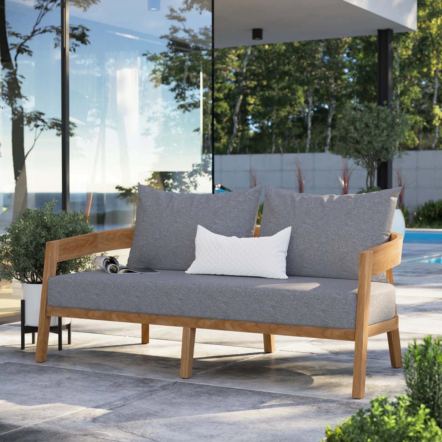 022 SI-1929578 | Lifestyle | Hazelton Teak Wood Loveseat by Evans & Londeen. Made from teak wood, polyester, mesh sling, plastic tack glides, stainless steel in a modern style.