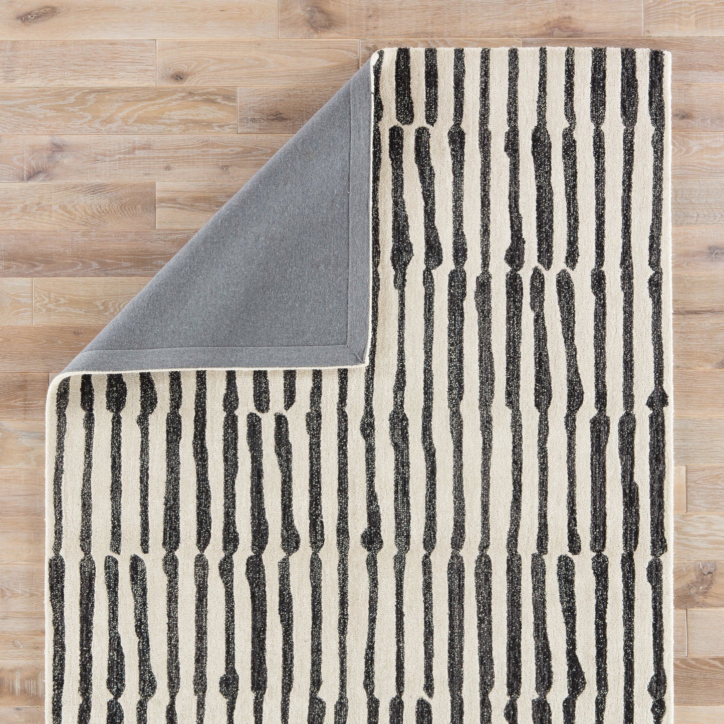 003 87455-30780,87455-30781 | Closeup | Vera by Nikki Chu ENK13 Rug by Jaipur Living in white, black. Made from unique in a unique style.
