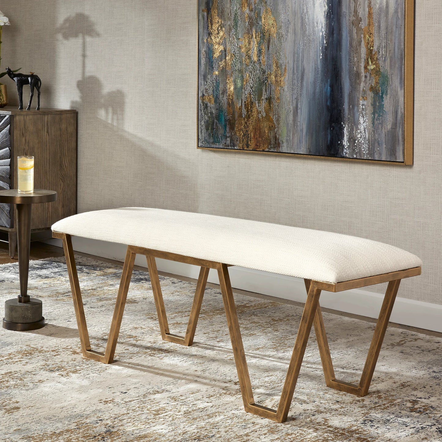 008 SI-1789777 | Lifestyle | Farrah Bench by Uttermost in antique gold leaf. Made from iron, mdf, polyester, foam in a modern style.