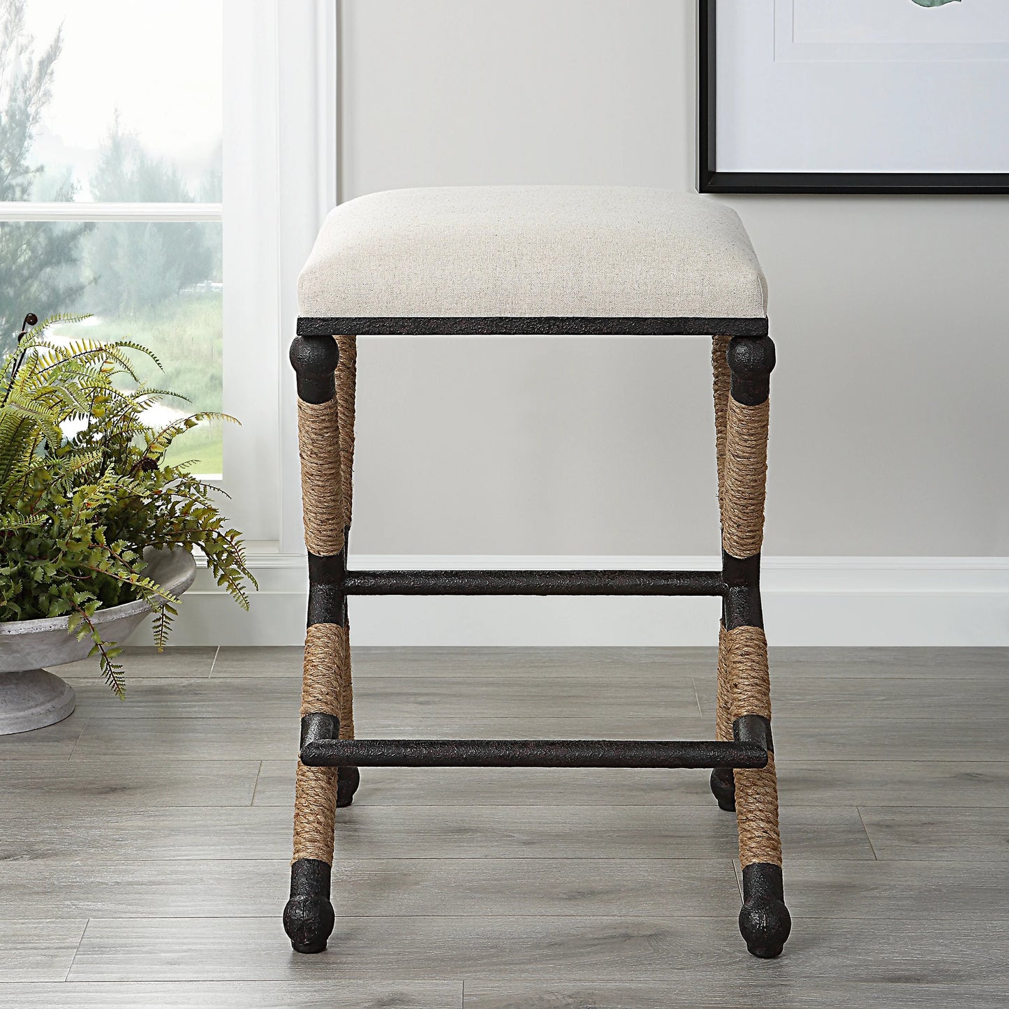 011 SI-1923686 | Lifestyle | Firth Rustic Oatmeal Counter Stool by Uttermost in black, natural. Made from mdf, farbic, iron, foam, rope in a coastal style.