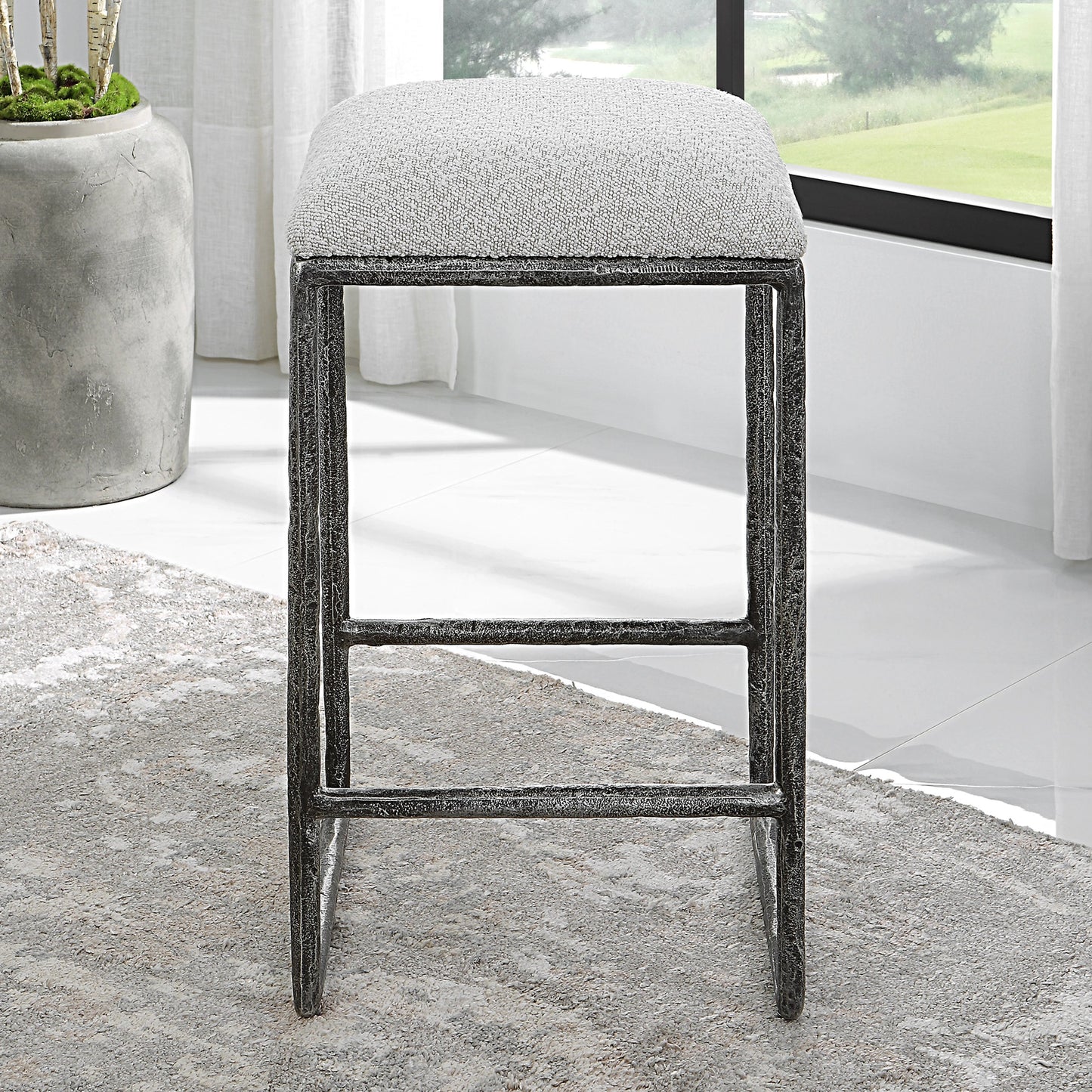 008 SI-1981307 | Lifestyle | Brisbane Counter Stool by Uttermost in ivory, gray and charcoal. Made from cast iron, mdf, foam, fabric in a modern style.