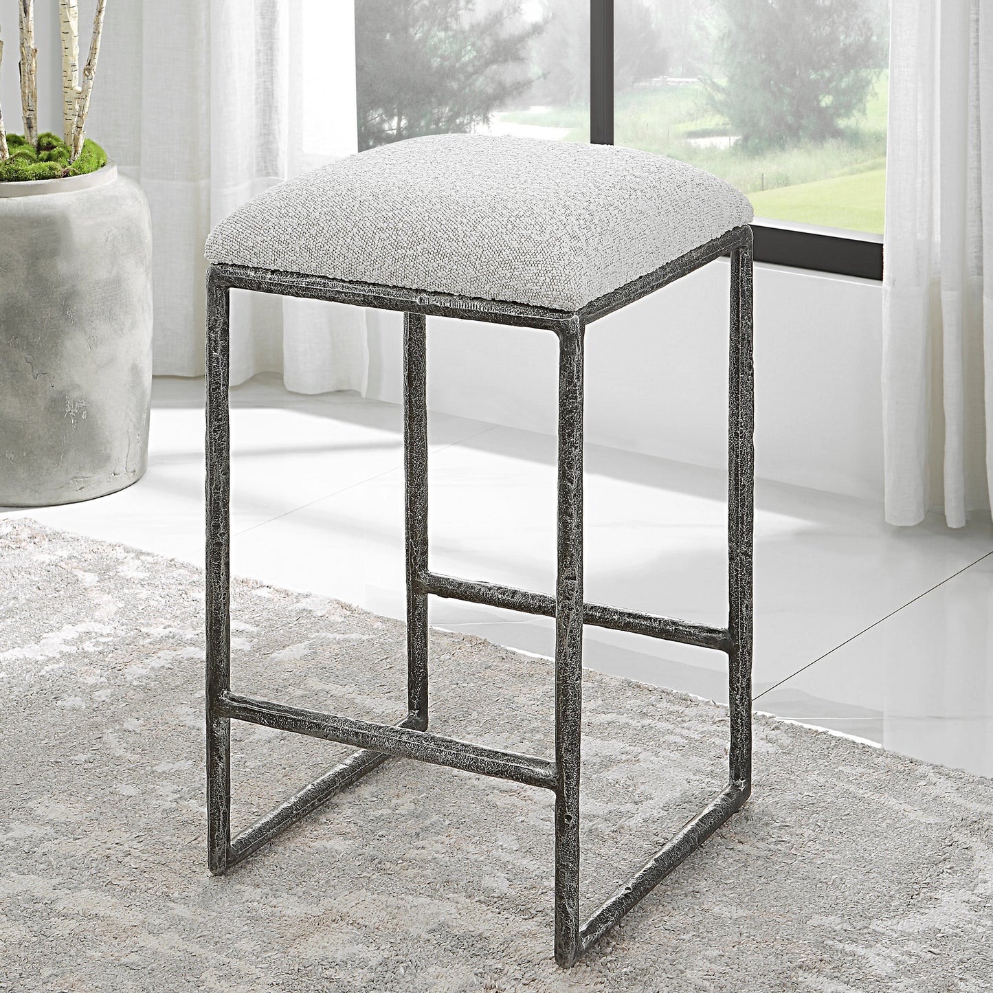 009 SI-1981307 | Lifestyle | Brisbane Counter Stool by Uttermost in ivory, gray and charcoal. Made from cast iron, mdf, foam, fabric in a modern style.