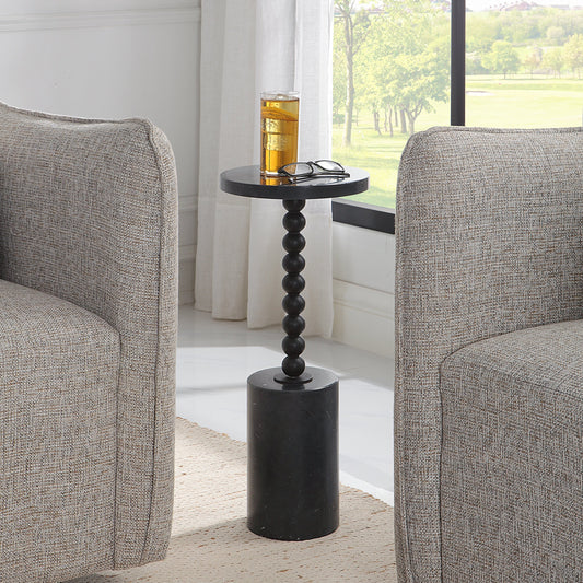 Bead Drink Table by Uttermost in black. Made from iron, marble in a modern style.