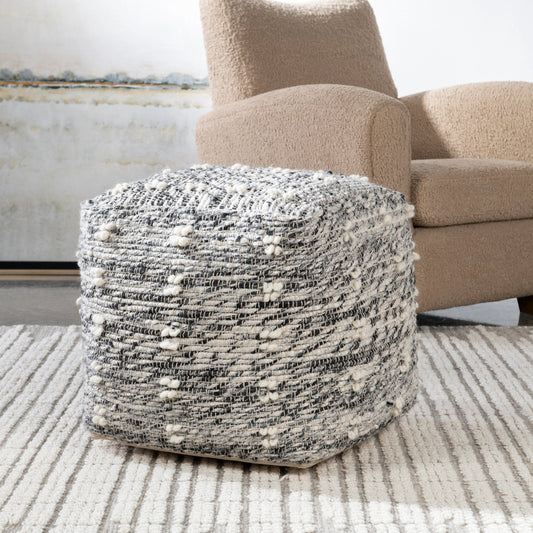 Narol Pouf by Uttermost in charcoal, black, white and black. Made from polyester, cotton, wool in a traditional style.