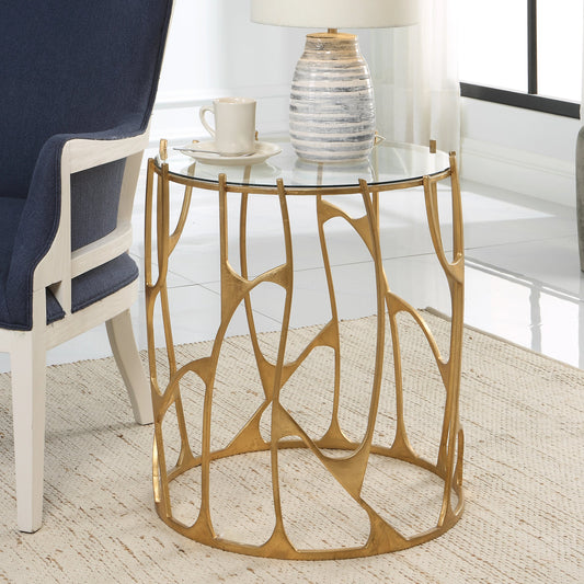 Ritual Side Table by Uttermost in aged gold leaf. Made from glass, iron in a modern style.