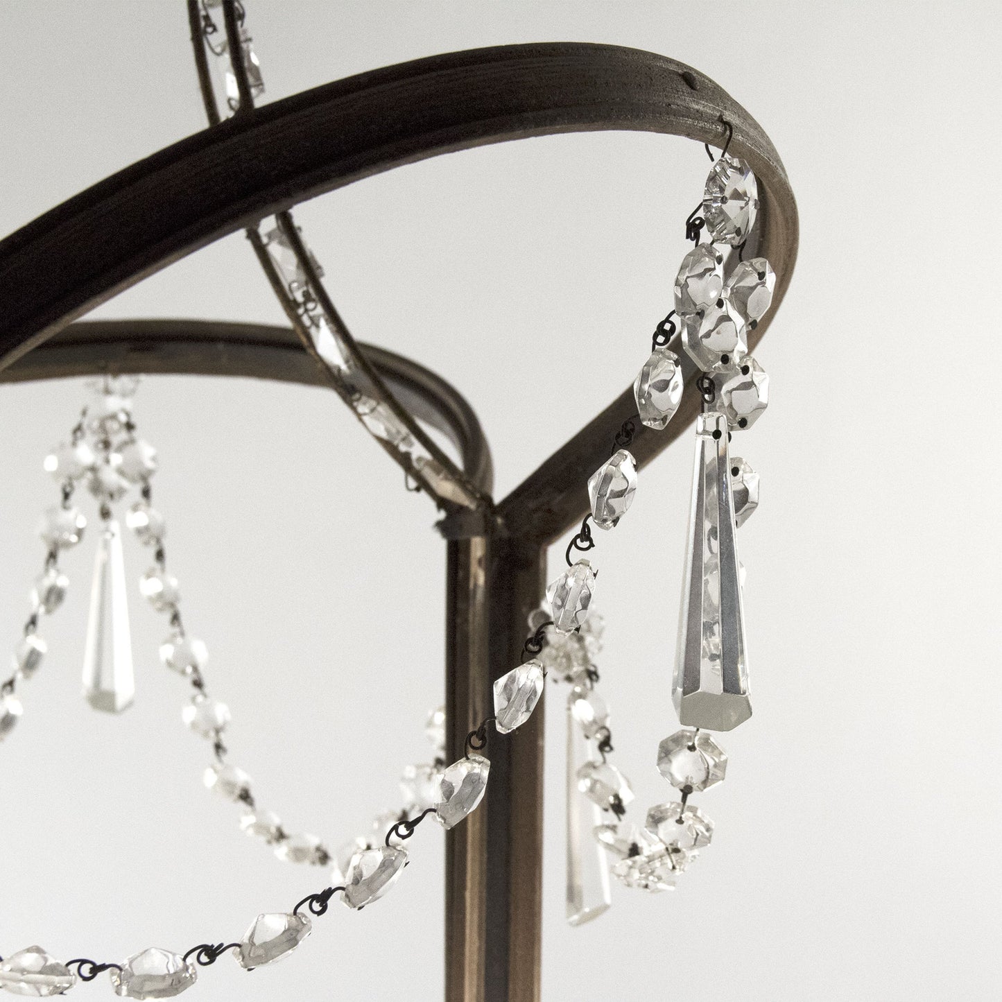 002 S-337227 | Closeup | Garland Chandelier by Zentique in weathered finish, gold leaf metal and crystal, elm. Made from crystal, elm in a traditional style.