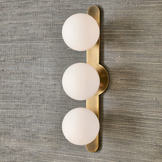 Droplet 3 Light Sconce by Uttermost in brass. Made from steel, glass in a modern style.