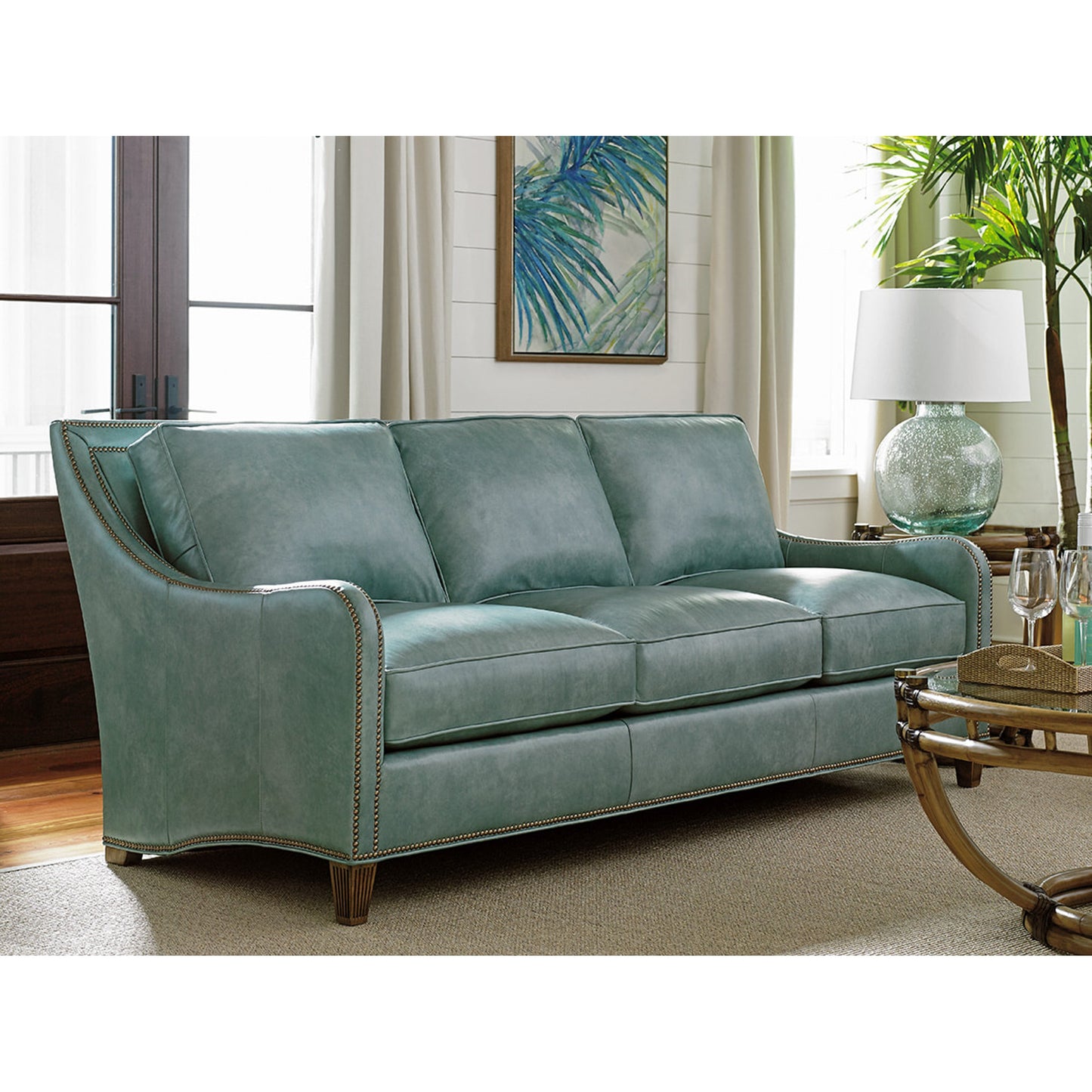 003 SR-836195 | Lifestyle | Koko Leather Sofa by Tommy Bahama Home in sea mist. Made from sea mist in a transitional style.