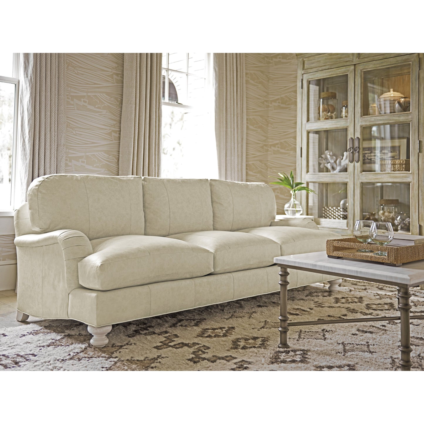 003 SR-836113 | Lifestyle | Gilmore Leather Arm Sofa by Tommy Bahama Home in seashell. Made from unique in a transitional style.