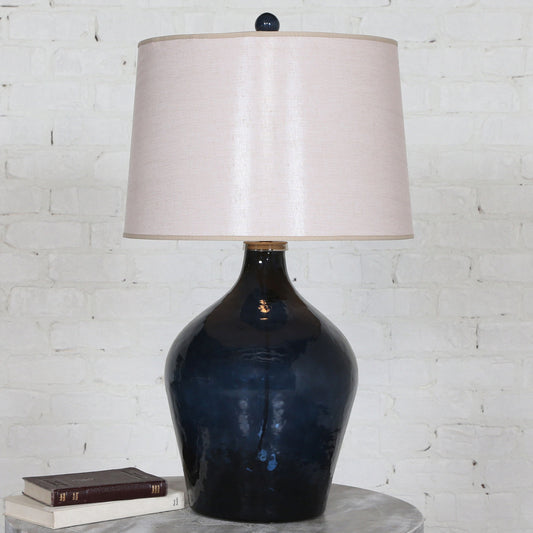 Lamone Lamp by Uttermost in blue. Made from 85% glass, 5% aluminum, 10% linen in a modern style.