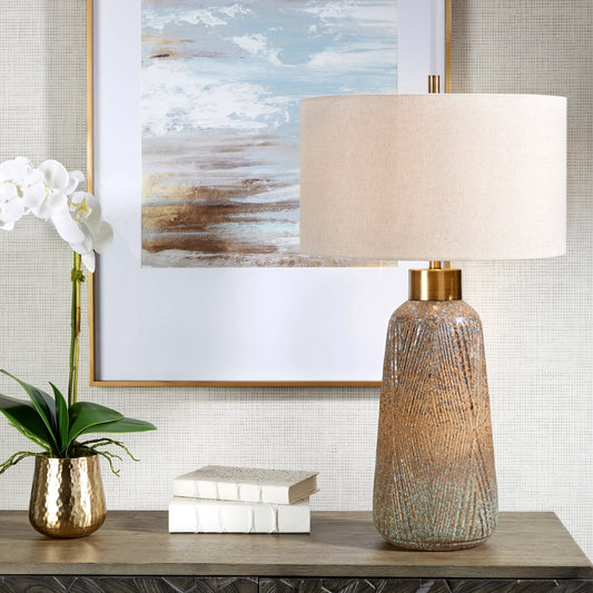 Western Sky Table Lamp by Uttermost in brass. Made from steel, ceramic, fabric in a modern style.