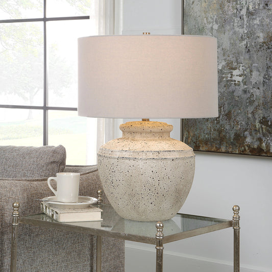 Artifact Table Lamp by Uttermost in aged stone. Made from steel, ceramic, fabric in a modern style.