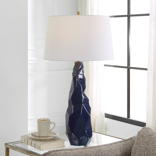 Kavos Table Lamp by Uttermost in navy blue. Made from ceramic, iron, fabric in a modern style.