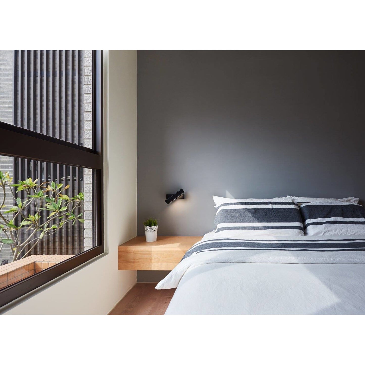 022 SR-381034 | Lifestyle | Mumu Wall Lamp by Seed Design. Made from aluminum, wood in a modern style.