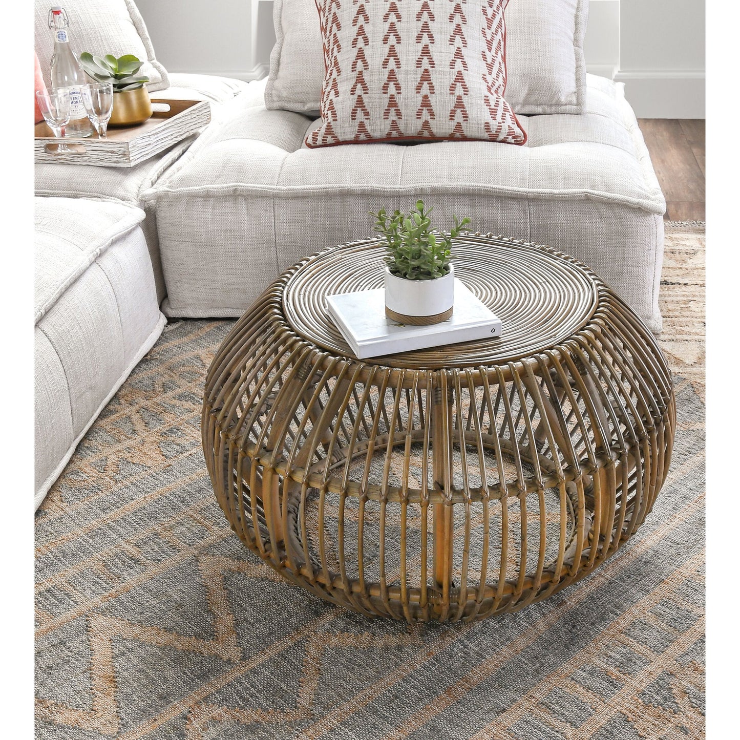 006 SR-897731 | Lifestyle | Lira Coffee Table by Kosas Home. Made from rattan subalio, jawit in a coastal style.