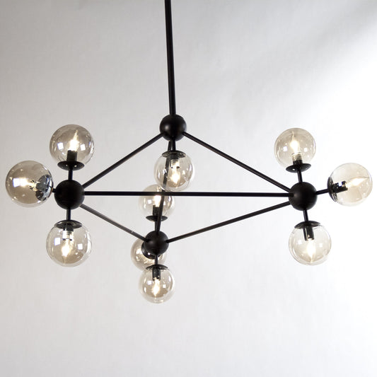 Cora Hanging Light by Zentique in weathered and metal. Made from metal, smoky glass in a modern style.
