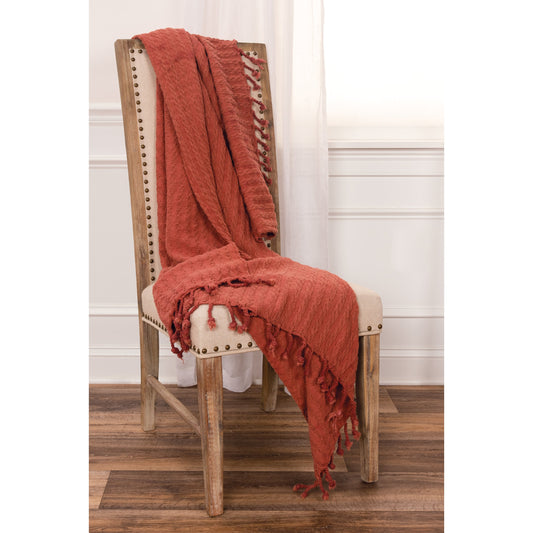 Valencia Throw by HedgeApple Essentials in rust. Made from cotton in a modern style.