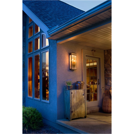 Whitaker Wall Lantern by Generation Lighting in astral bronze. Made from powder coated steel in a traditional style.