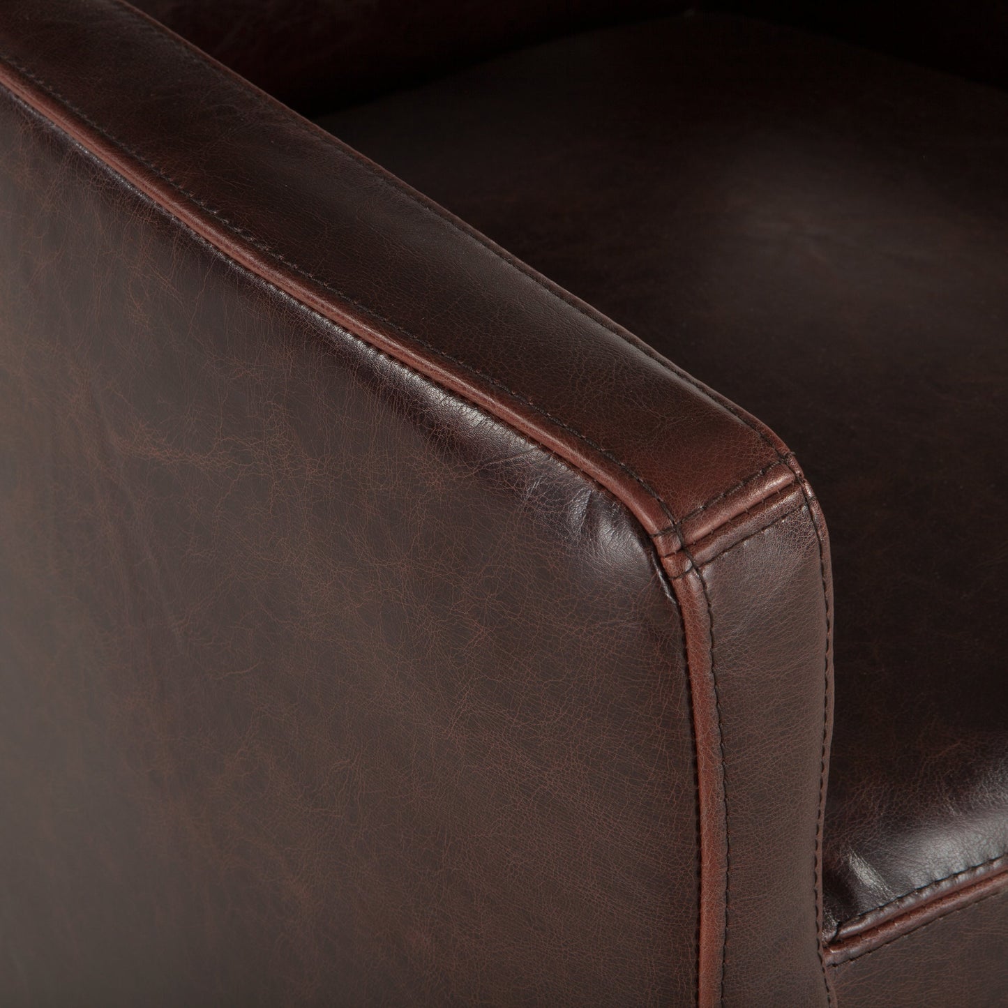 004 SR-877027 | Closeup | Lily Armchair by World Interiors in brown and distressed. Made from birch wood, bi-cast leather in a transitional style.
