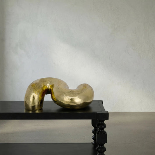 The Snake by Noir in antique brass. Made from metal alloy in a modern style.