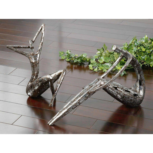 Dahy Statues (Set of 2) by Uttermost in silver. Made from polyresin in a modern style.