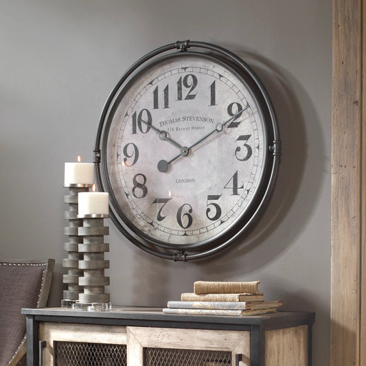 Nakul Industrial Wall Clock by Uttermost. Made from iron, mdf, glass, movement in a traditional style.