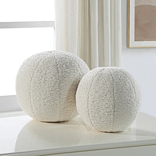 Capra Ball Sheepskin Pillows by Uttermost. Made from fabric in a transitional style.