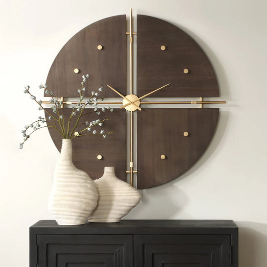 Elegance Wall Clock by Uttermost in gold. Made from mdf, iron, walnut veneer in a modern style.