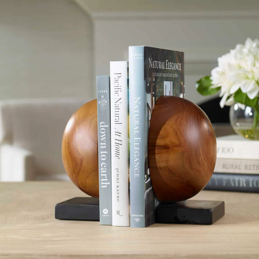 Teak and Noir Bookends by Uttermost in teak. Made from teak wood in a traditional style.