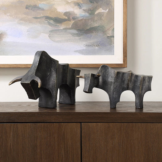Regal Bull Sculptures by Uttermost in dark bronze. Made from polyresin in a cottage & farmhouse style.