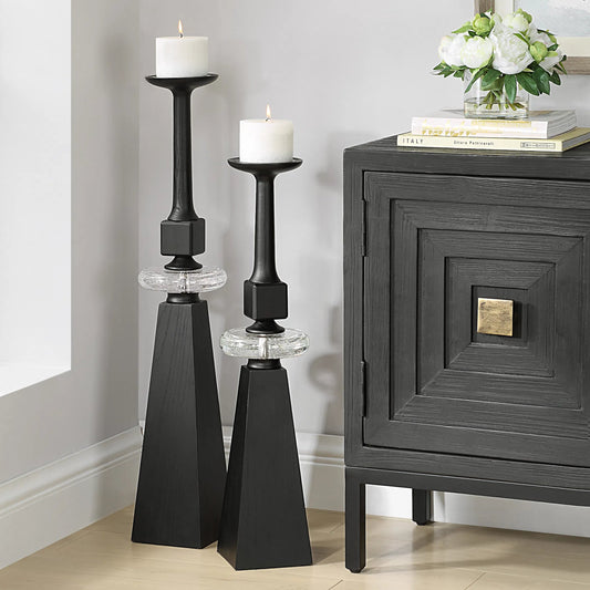 Ebon Glow Floor Candleholders (Set of 2) by Uttermost in black. Made from wood, crystal, metal in a modern style.