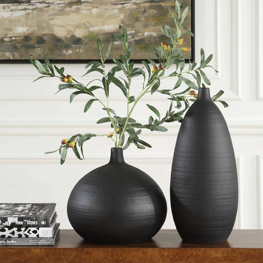 Bower Vases by Uttermost in black. Made from porcelain in a modern style.