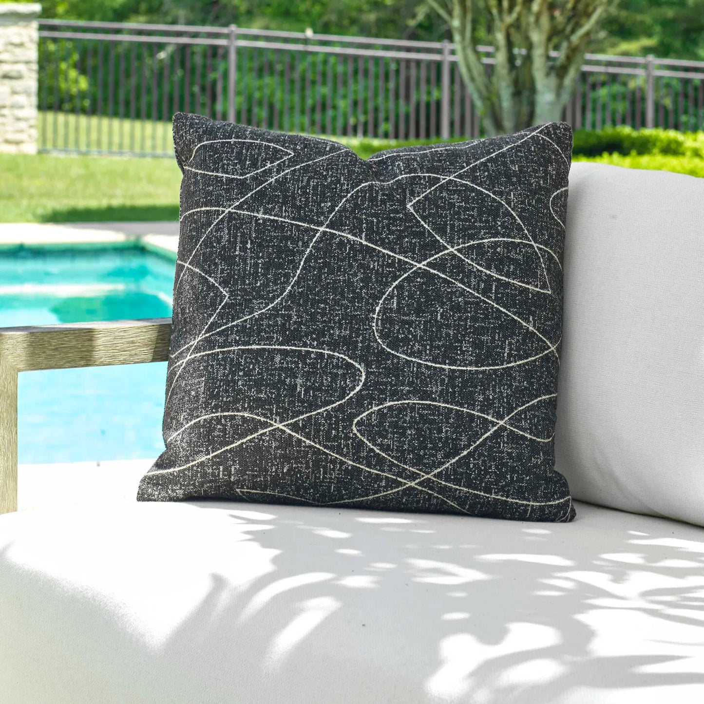 003 SI-2386893 | Lifestyle | Loopy Loop Outdoor Onyx Pillow by Uttermost in onyx black. Made from acrylic, polyester in a modern style.