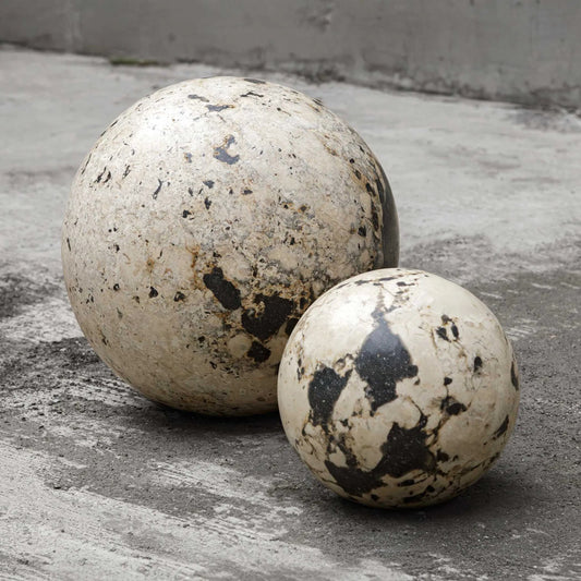 Nouveau Indoor-Outdoor Spheres by Uttermost in black, white and black. Made from coral stone, black resin in a unique style.
