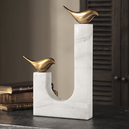 Songbirds Brass Sculpture by Uttermost in white, brushed brass. Made from brass, marble in a modern style.