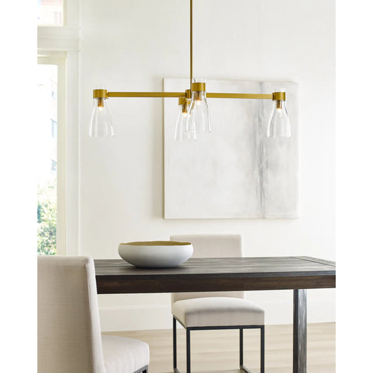 Moritz Four Light Linear Chandelier by Visual Comfort & Co. in burnished brass. Made from steel in a modern style.