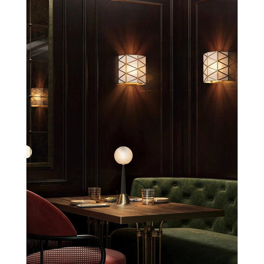 Polyhedron Wall Sconce by Currey and Company in white, antique brass. Made from glass, brass, metal in a modern style.