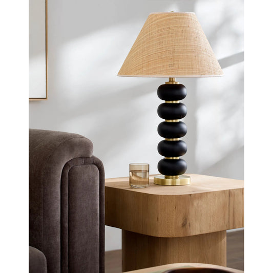 Anefis Accent Table Lamp by Surya in translucent, clear, black, metallic gold, brown. Made from rubber wood, iron, seagrass, polyester in a modern style.