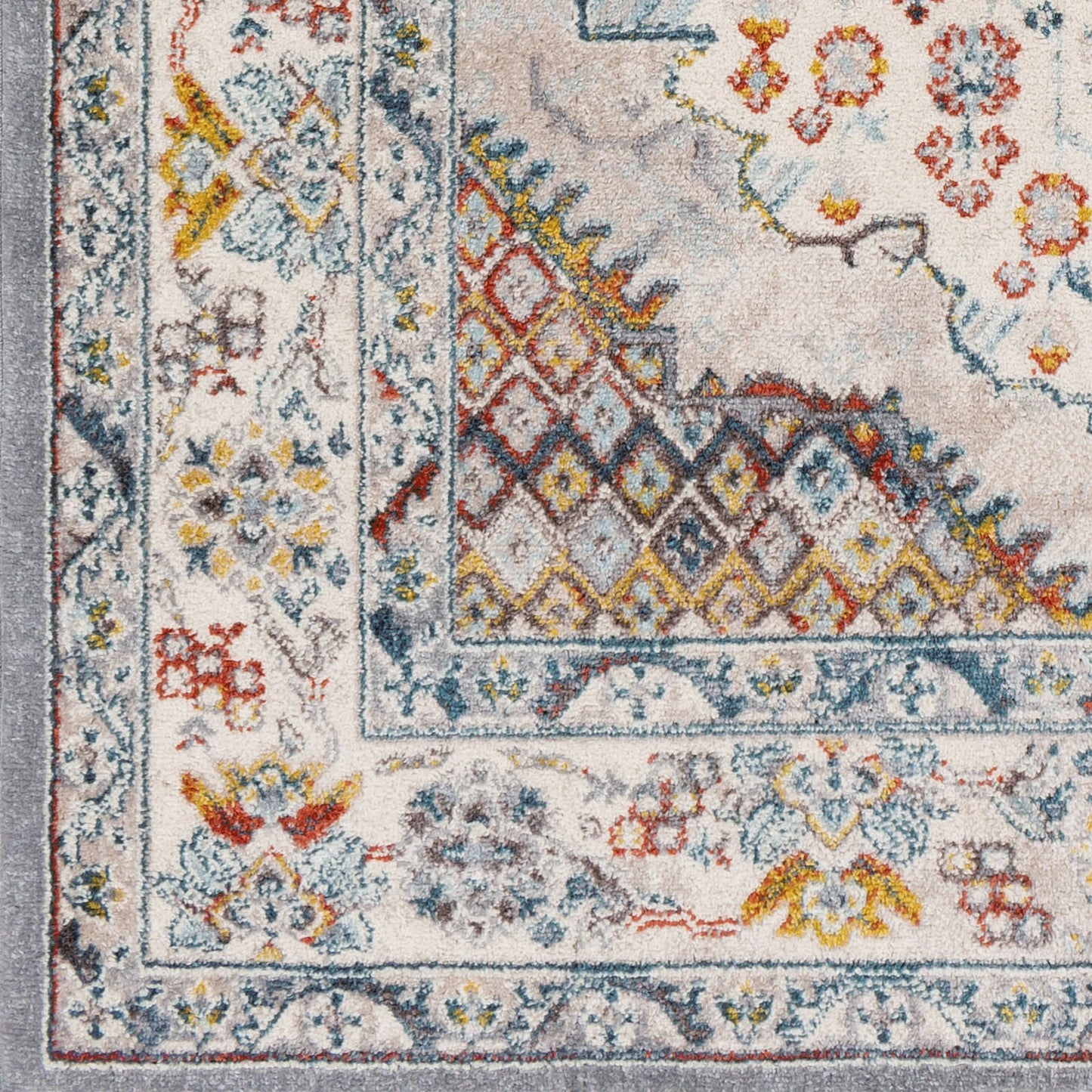 003 SI-2167436,SI-2167437 | Closeup | Ankara Rug by Livabliss in gray, taupe, ice blue, dark blue, cream, rust. Made from polypropylene in a unique style.