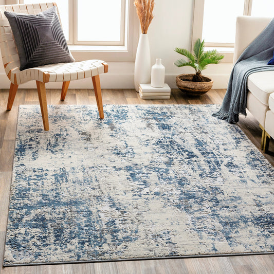 Alpine Rug by Livabliss in blue, medium gray, gray, charcoal, off-white. Made from 60% polypropylene, 40% polyester in a traditional style.