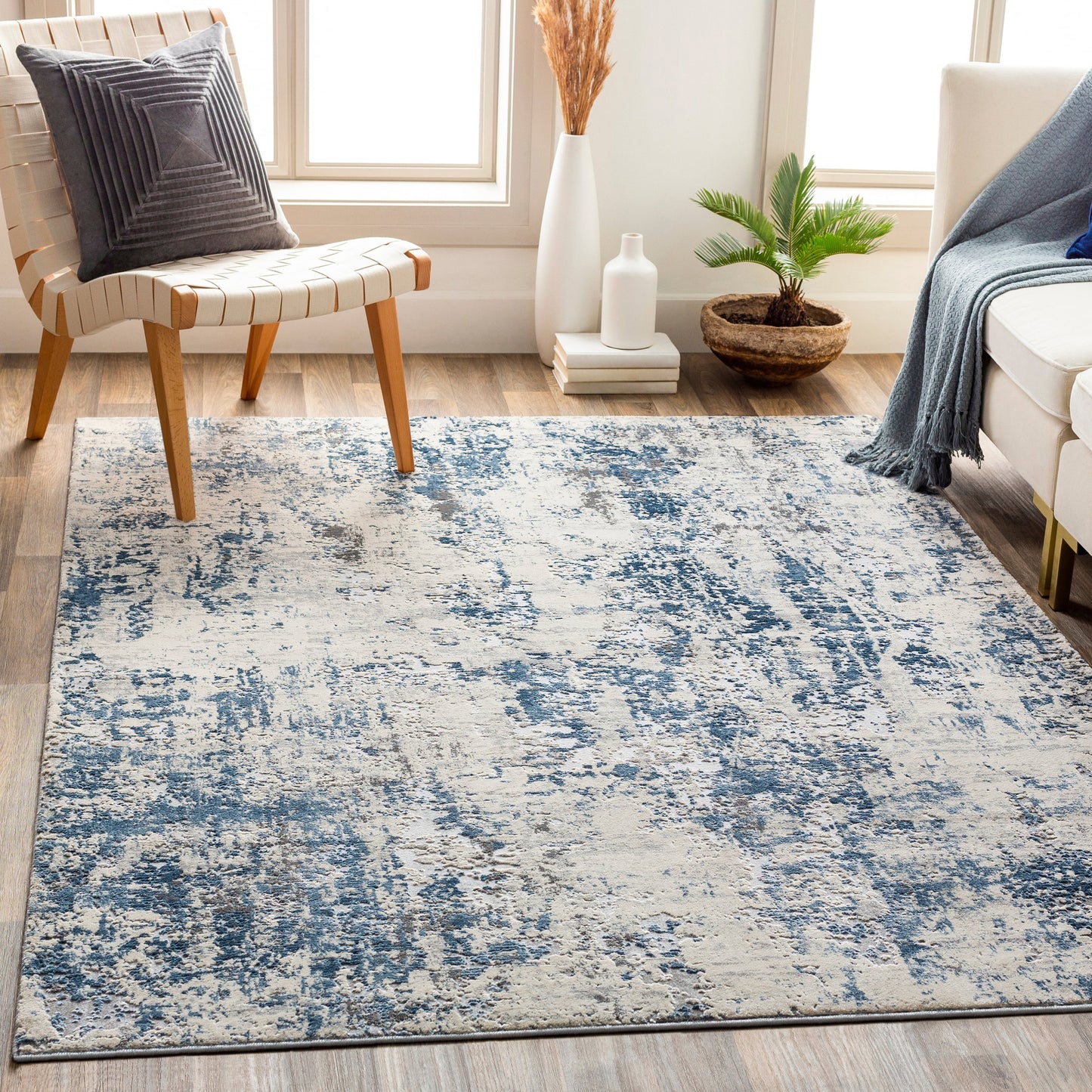 008 SI-1875884,SI-1875888 | Lifestyle | Alpine Rug by Livabliss in blue, charcoal. Made from 60% polypropylene, 40% polyester in a traditional style.