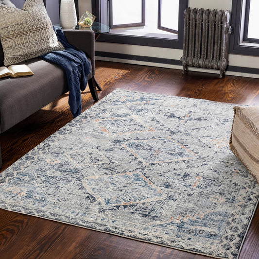 Amore Rug by Livabliss in navy, denim, gray, rust, light beige, cream. Made from 100% polyester in a traditional style.