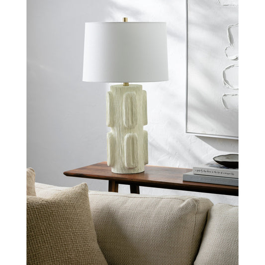 Antomi Accent Table Lamp by Livabliss in body: ivory, shade: white, finial: metallic - bronze, harp: metallic - brass, cord: translucent and paintedplated. Made from resin, linen, iron in a modern style.
