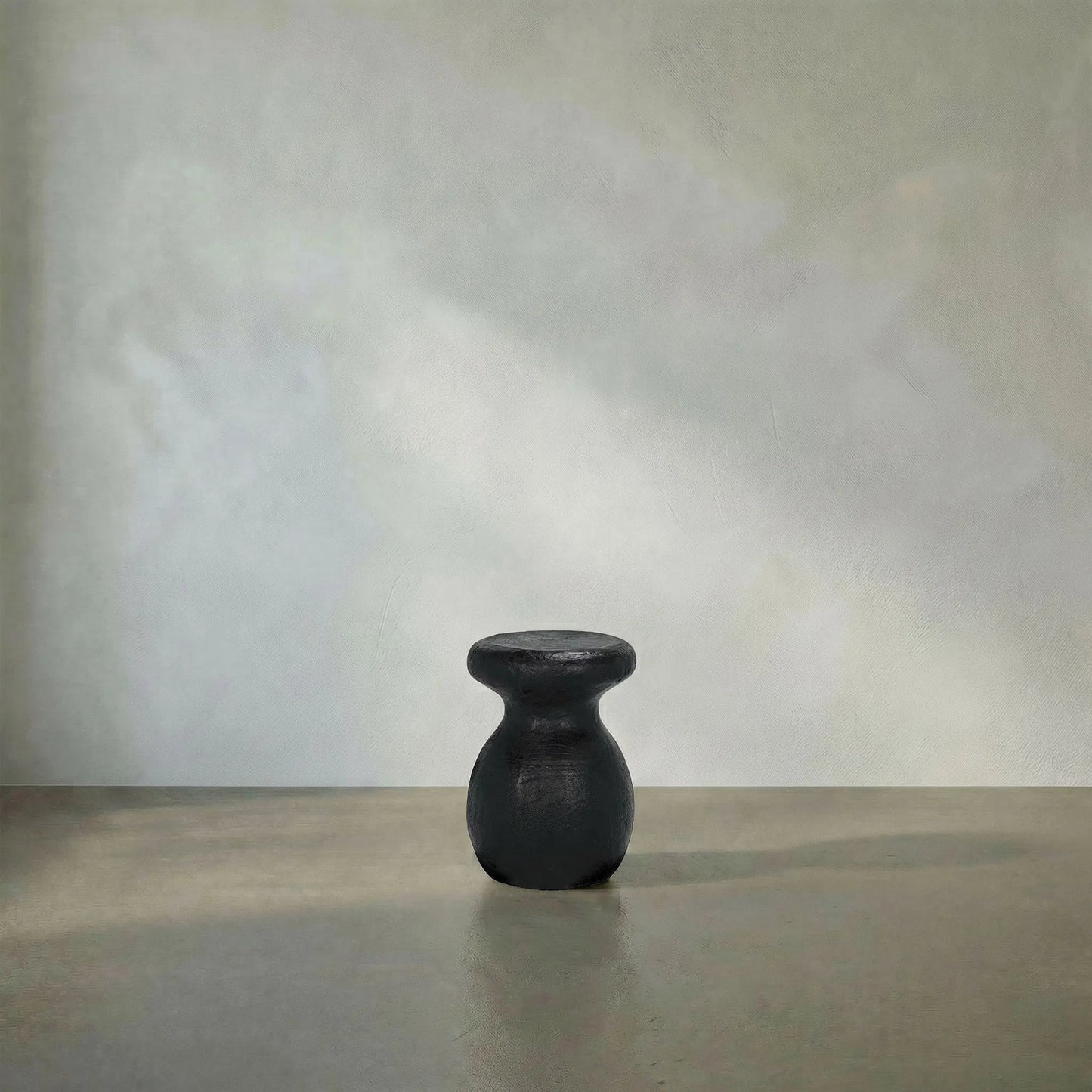 018 SI-2130215 | Lifestyle | Samson Stool/Side Table by Noir in black burnt fiber cement. Made from fiber cement in a transitional style.